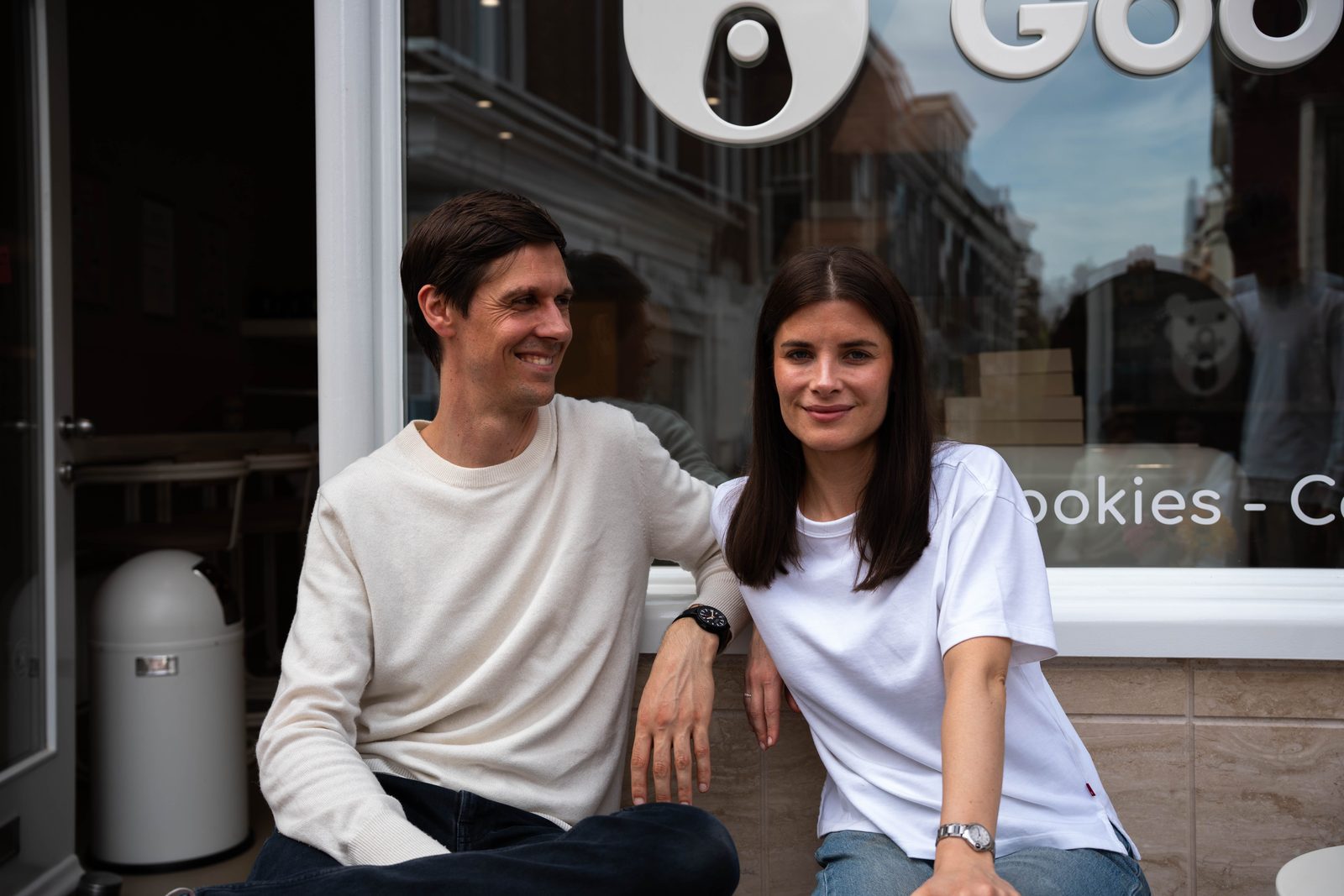 Two founders posing by the shop window